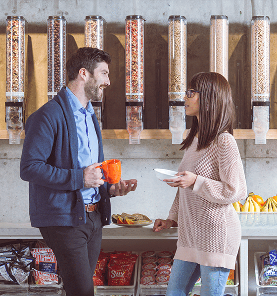 People laughing over coffee and breakfast in a ptwmt breakroom, pantry service