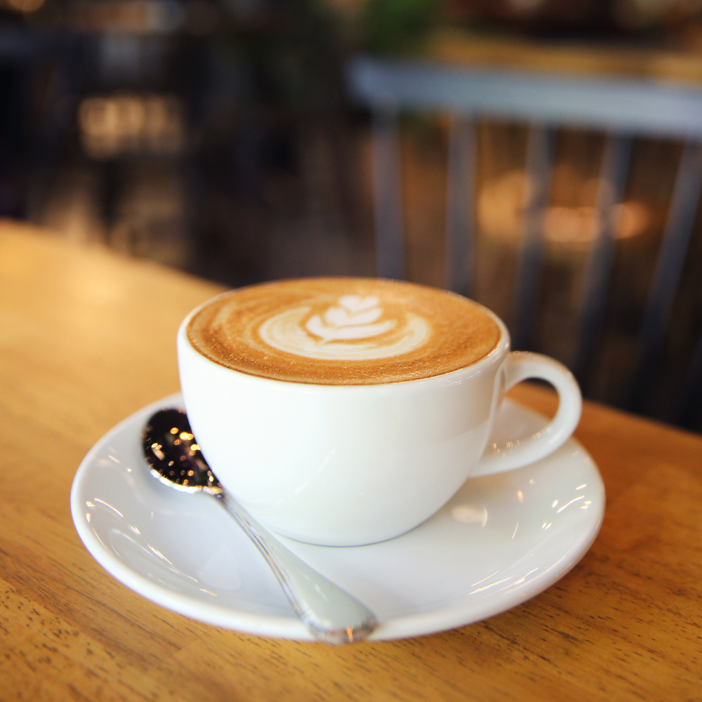 Latte art in a white mug, cappuccino, Tradecraft coffee