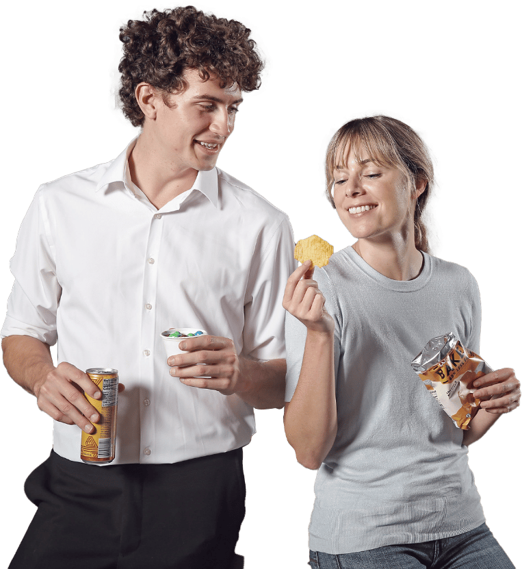 Employees eating snacks and smiling, work break, snacks and beverages
