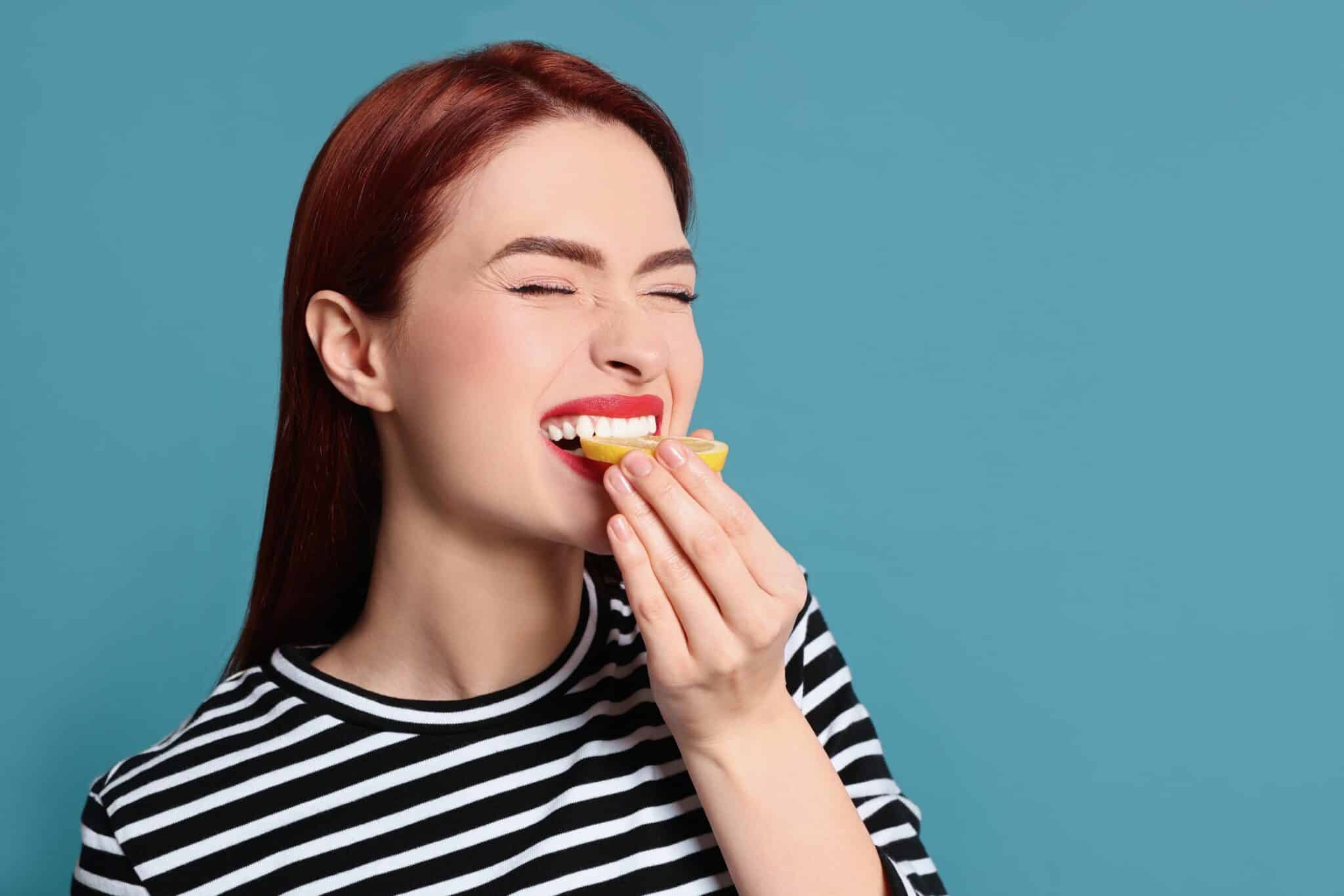 Woman Eating Lemon